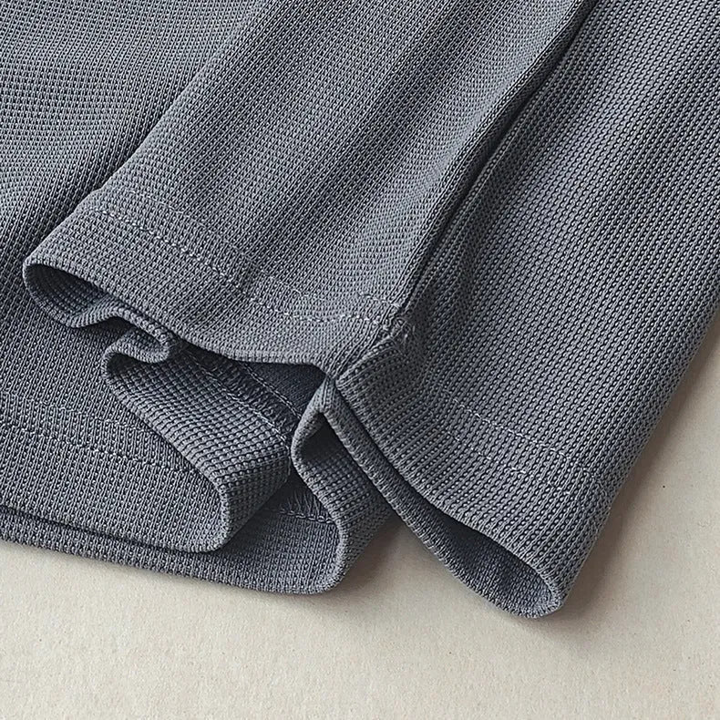 Men's heavyweight waffle-knit short-sleeve t-shirt in a solid colour, shown on a hanger.