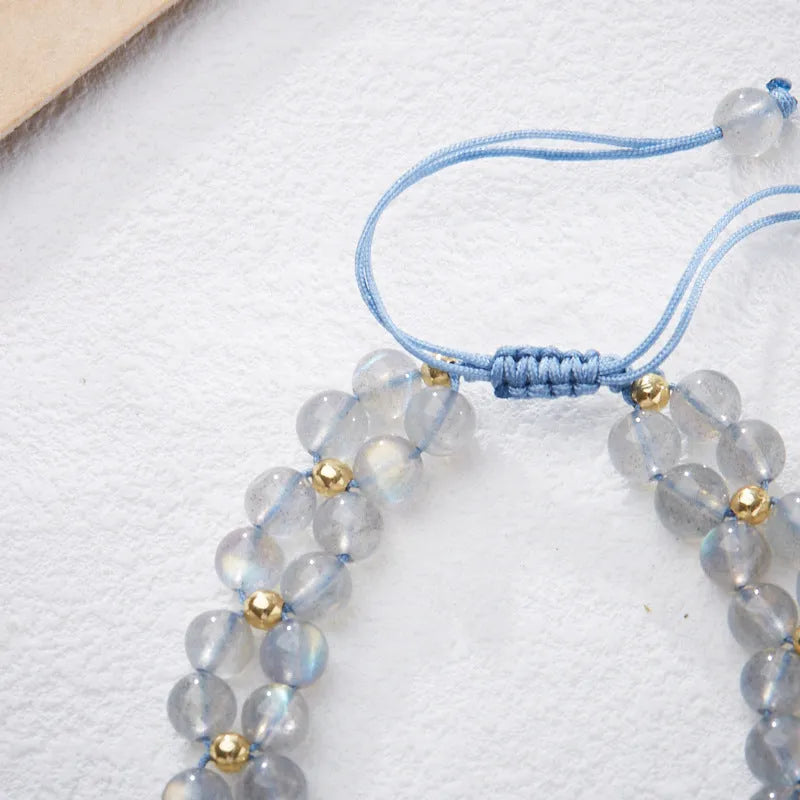 Handwoven women's bracelet with grey moonstone butterfly centrepiece on geometric design