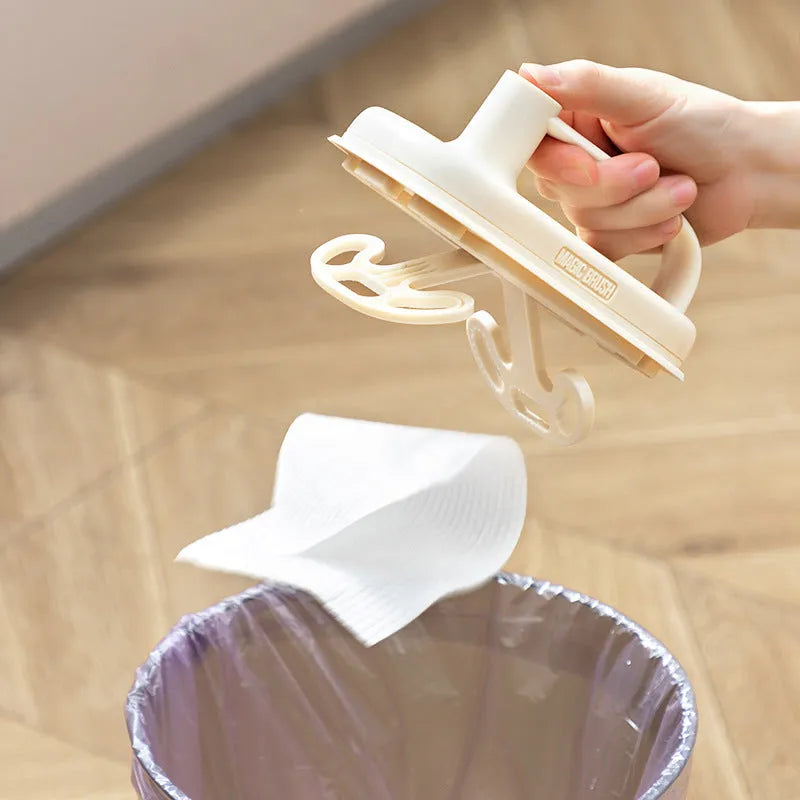 Magic Brush disposable cleaning tool with plastic handle, 50 white non-woven rags, and a storage box holder.