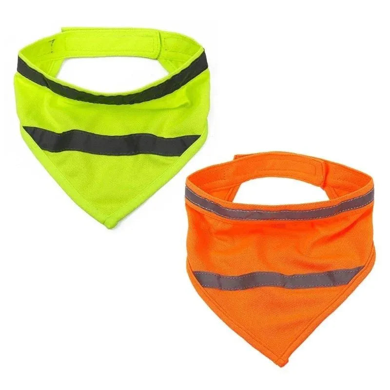 Yellow and orange polyester dog bandana with reflective stripes laid flat, showing adhesive strap closure.