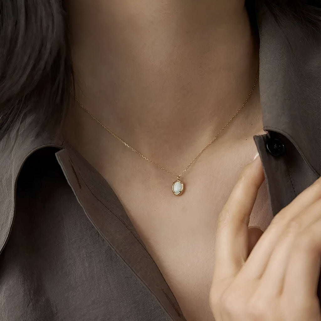 Oval geometric jelly opal pendant on a chain with 14K gold or white gold plating over S925 silver.