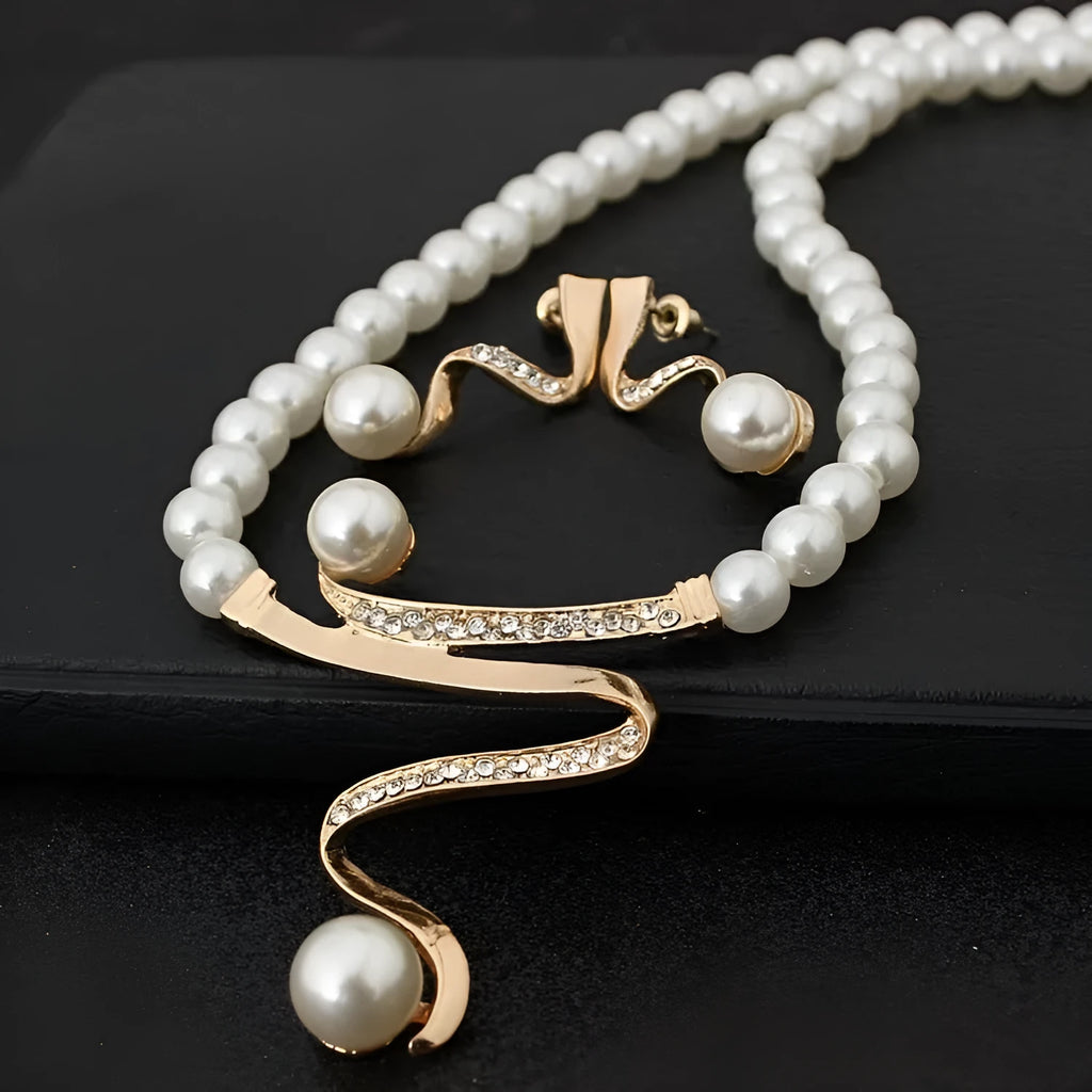 Gold electroplated pearl necklace and earrings suite with drop-shaped pendants and deep V clavicle design