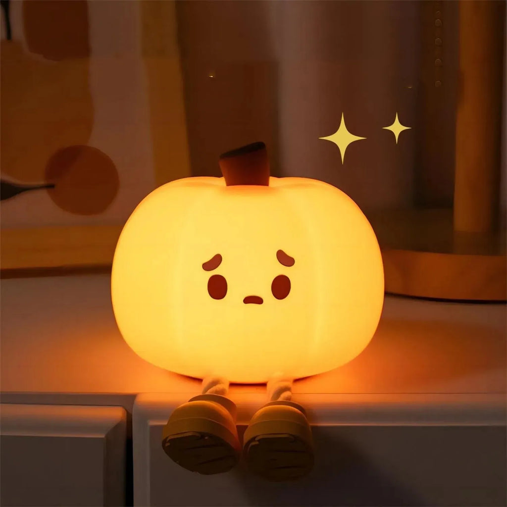 Soft silicone pumpkin-shaped night light with warm yellow glow