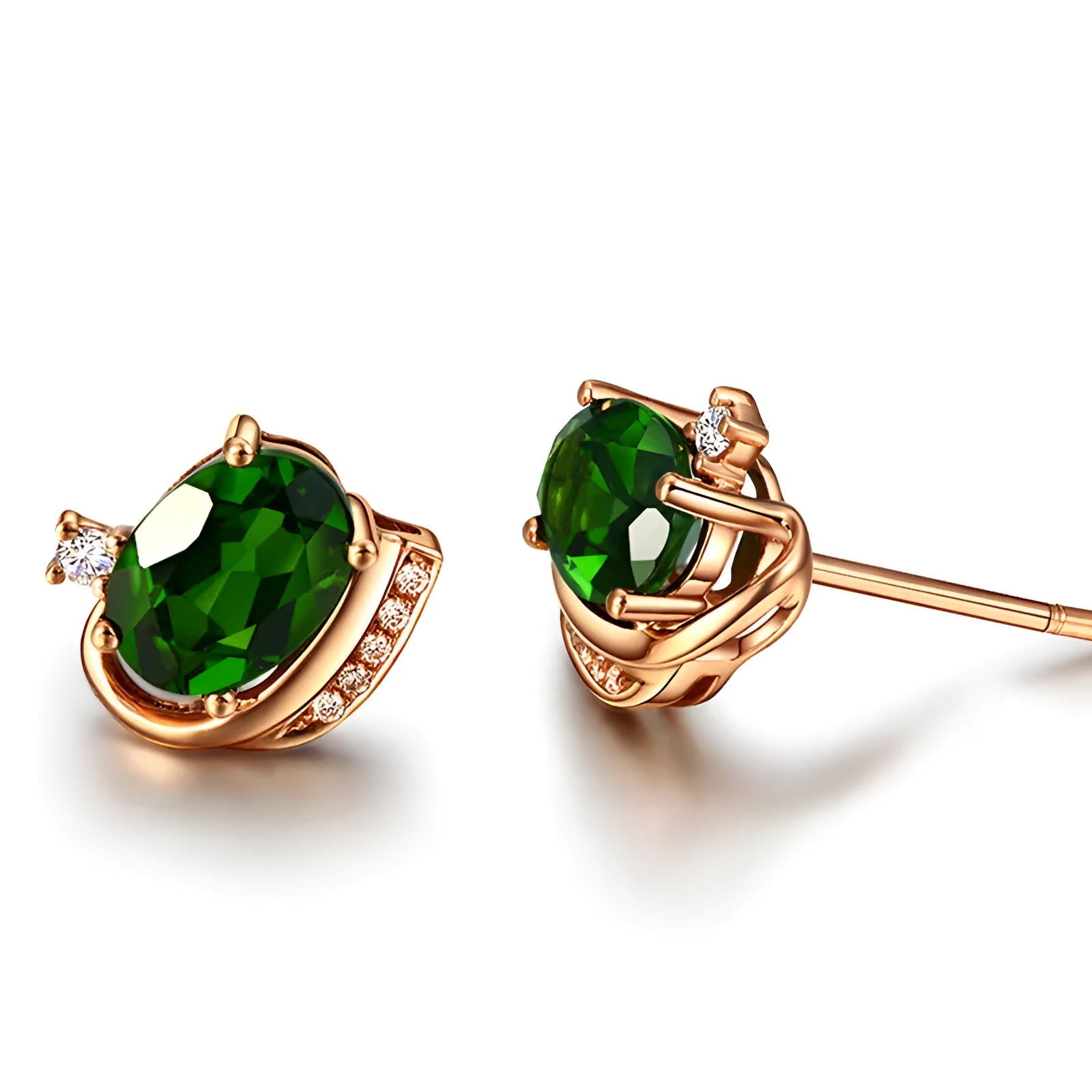 Pair of green ghost crystal stud earrings in silver with diamond-cut geometric shape on white background