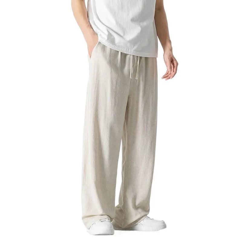 Men's beige bamboo fibre linen trousers with a straight leg, cropped length, and drawstring waist.