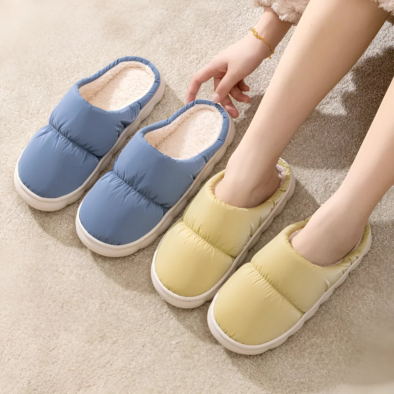 Down cotton house slippers with artificial leather upper, rubber sole, and plush lining in blue colour