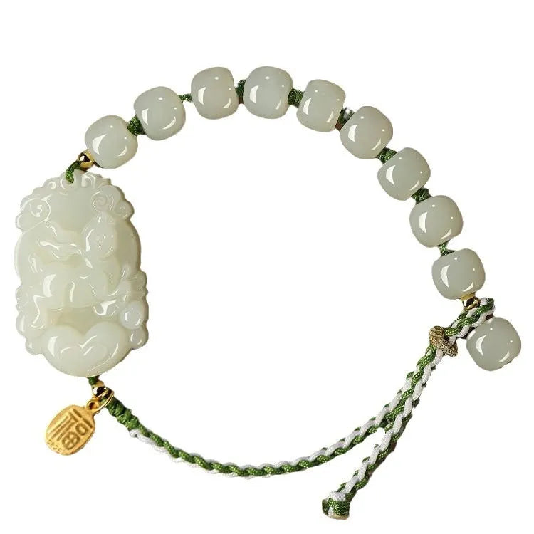 Hetian Jade Chinese zodiac bracelet on red cotton rope with S925 silver card for Year of Rabbit.