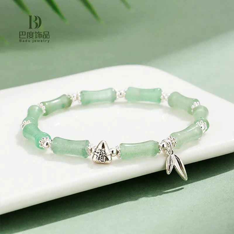 Electroplated bamboo strawberry crystal bracelet for women in green aventurine, showing natural stones on a bracelet.