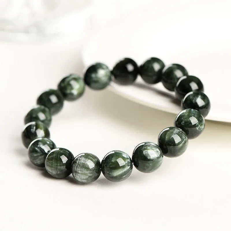 Green Dragon Crystal bracelet with 8-9mm round beads and a Ruyi element.