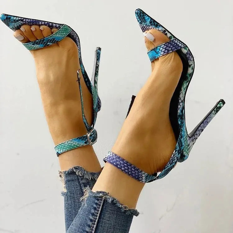 Blue women's high heels with buckle fastening and hollow-out design on artificial PU leather upper.