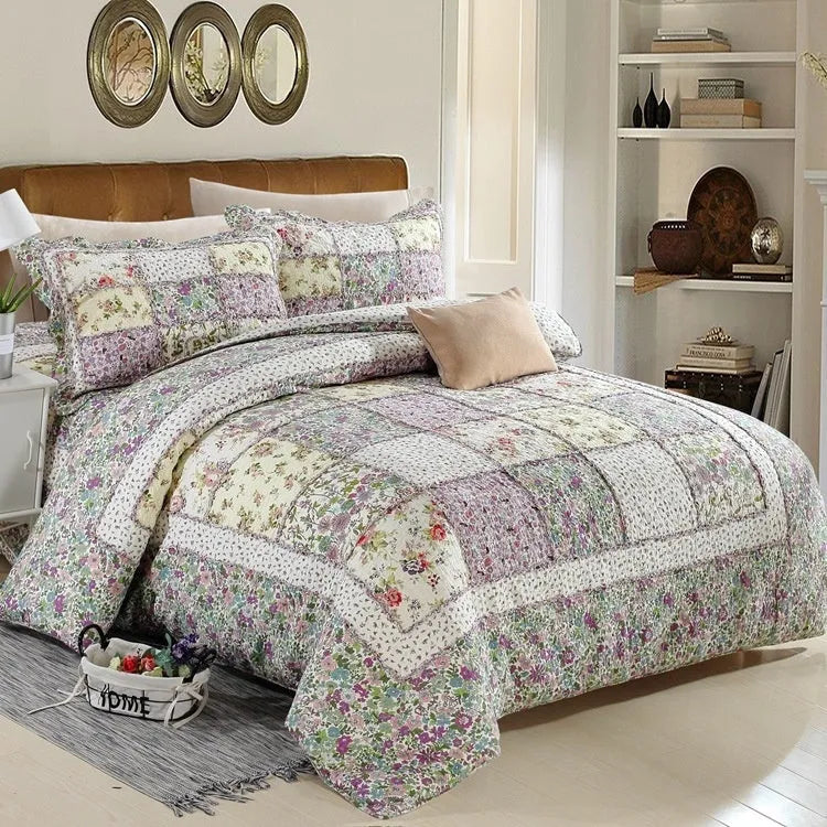 Washed pure cotton quilted bedspread and matching pillowcases set on a bed, shown in a beige colour option.