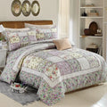 Washed pure cotton quilted bedspread and matching pillowcases set on a bed, shown in a beige colour option.