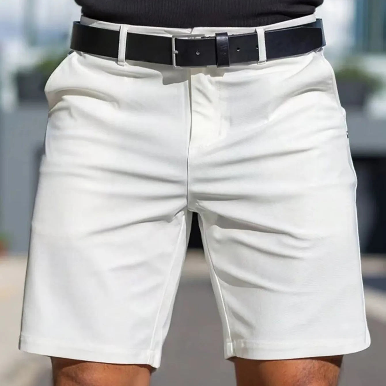 Men's apricot-coloured straight-leg polyester shorts with a fifth-pants length on a neutral background.