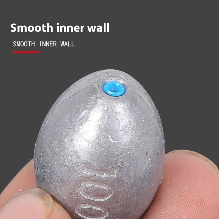 Tongxin olive-shaped lead fishing sinker with scale texture and internal plastic core.