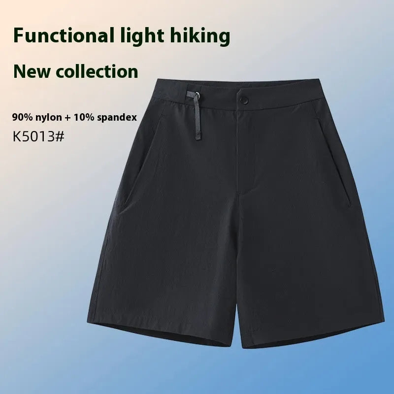 Man wearing army green quick-dry sports shorts with an elastic waistband for running or climbing.