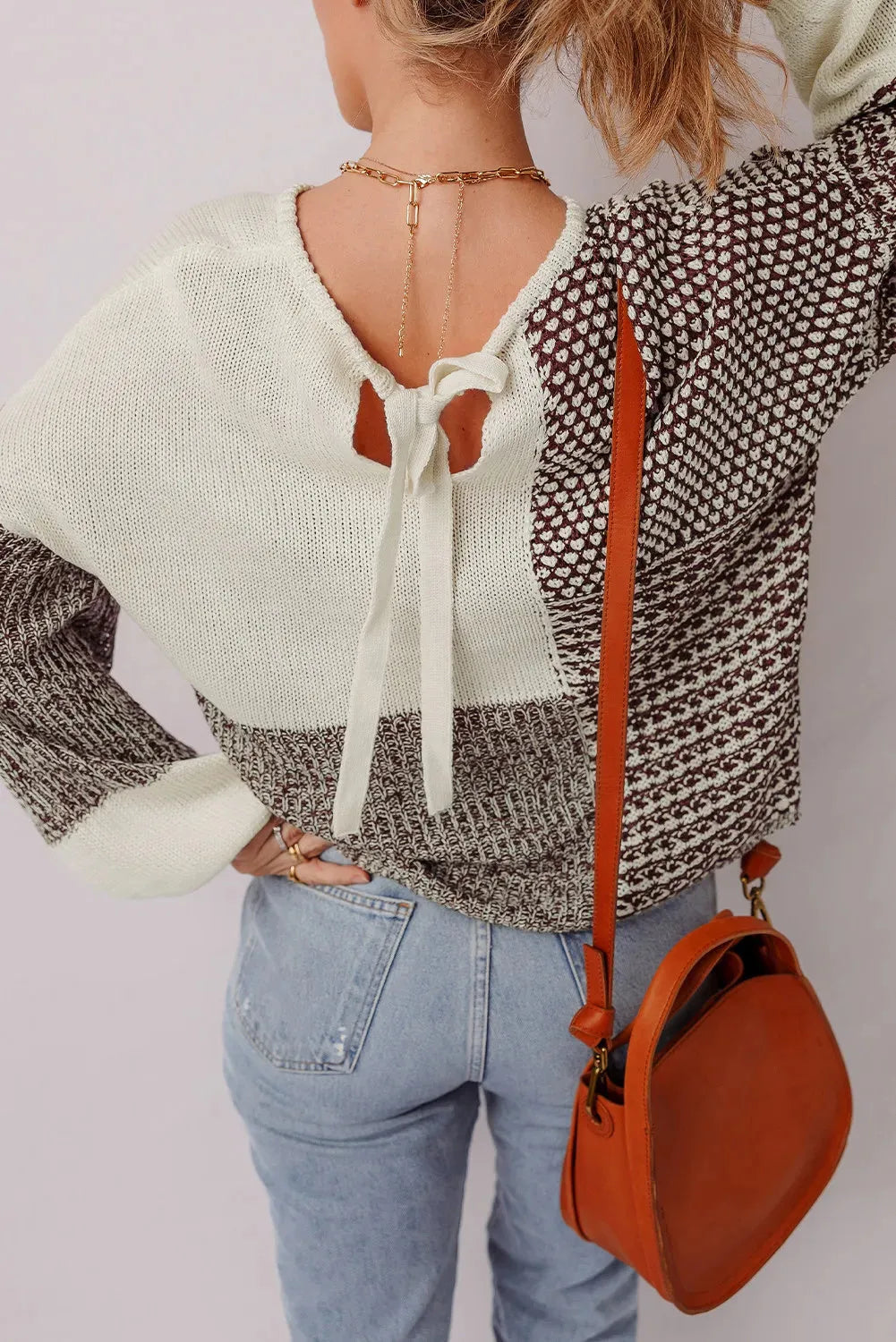 Dark khaki loose sweater with colour block back tie and drop shoulder design.