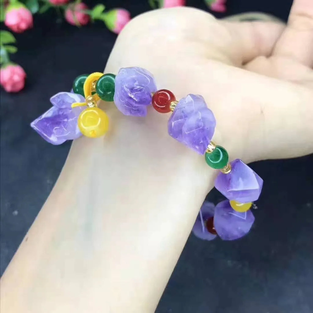 Natural shaped purple amethyst bead bracelet with a fu character charm for women.