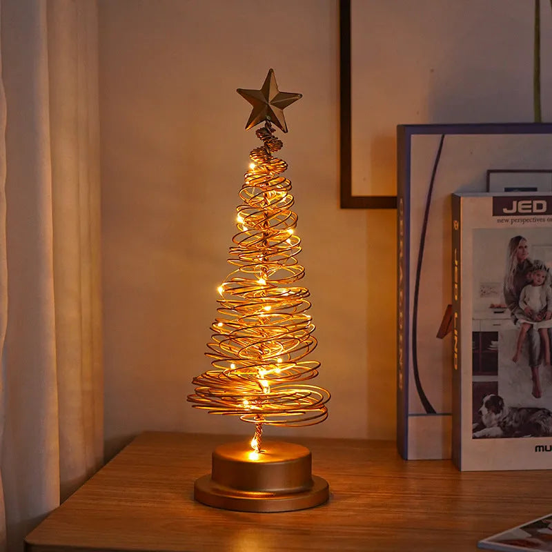 Wrought iron LED Christmas tree light with spiral design and warm white illumination on table