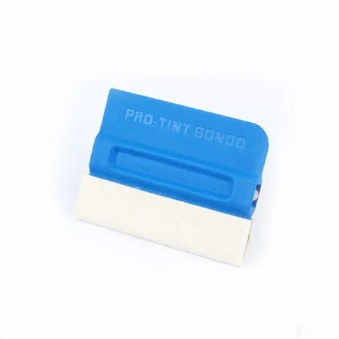 Car film application scraper tool with magnetic head and ABS handle on a work surface.