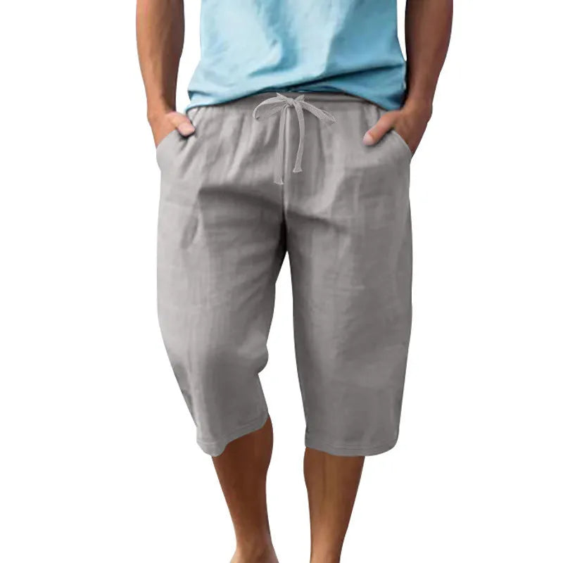 Men's loose fit linen shorts in light blue colour with a high waist and drawstring.