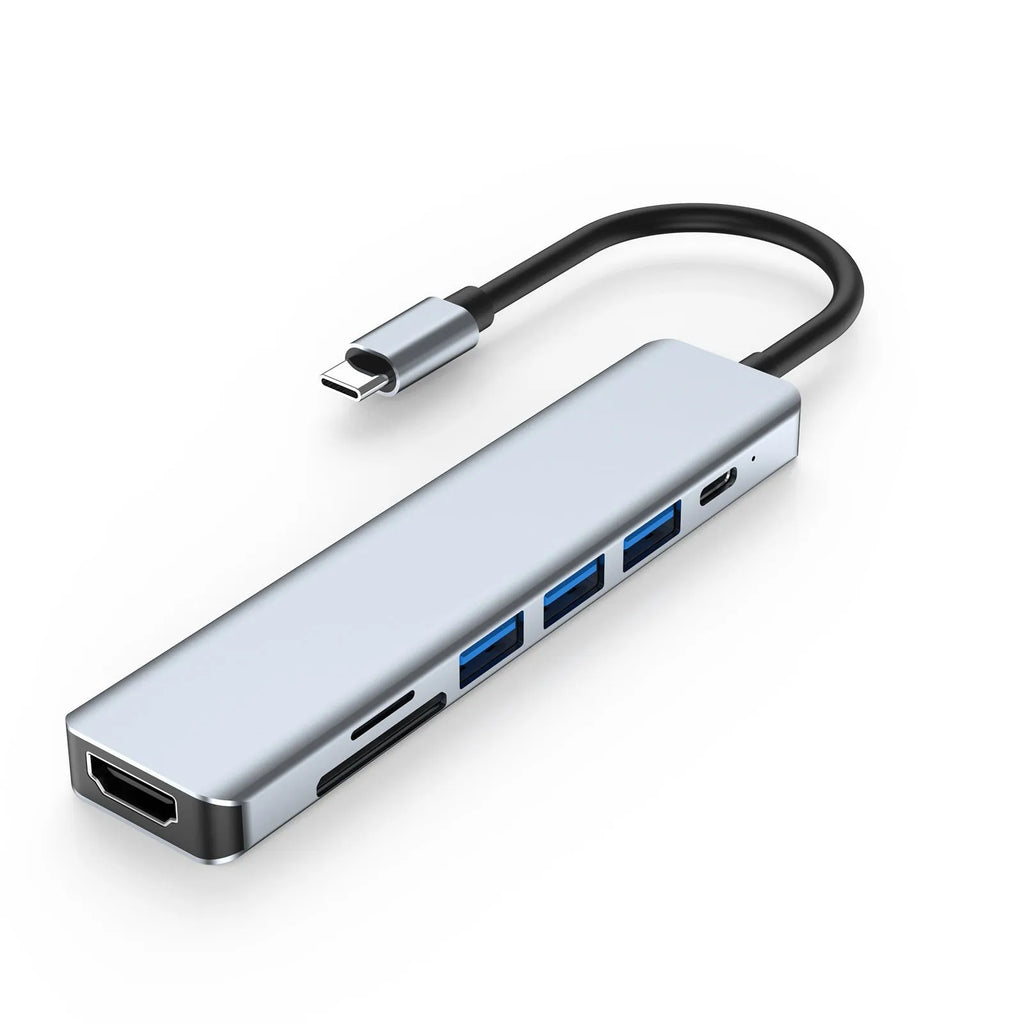 Seven-in-one USB C docking station expander hub with aluminium housing and multiple ports.