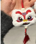 Blue and yellow handmade plush lion keychains with star stone decoration on a cartoon style tassel ornament.