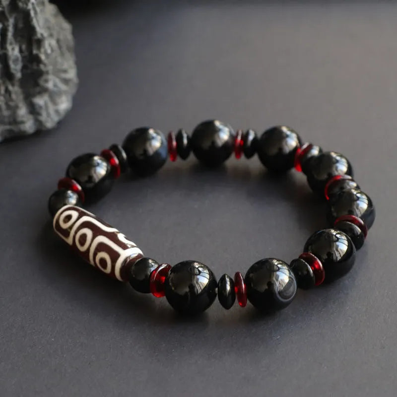 Black agate dzi bead bracelet with 11mm geometric beads in hand-woven construction