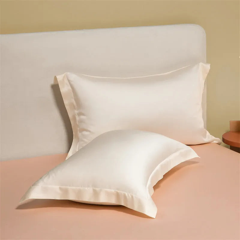 200 thread count Lenzing Tencel quilt cover and sheet set in Aurora Blue, laid on a bed.