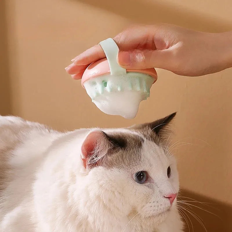 Blue silicone pet bathing brush with soft bristles for massaging and scrubbing cats and dogs.