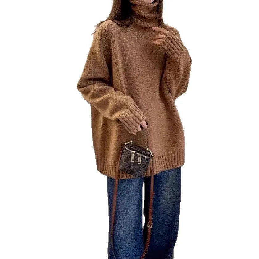 Women's loose grey turtleneck sweater with a thick 3D patterned texture and curling collar.