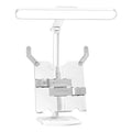 Adjustable desk lamp with three light temperature settings on a bookshelf