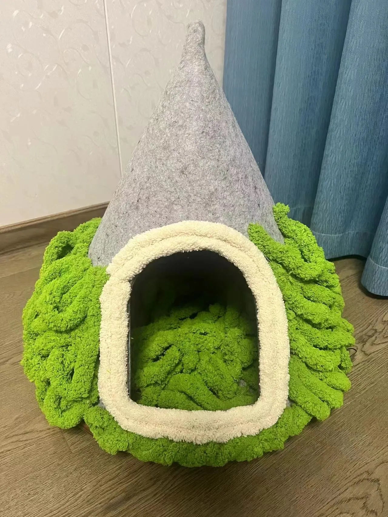 Grey handmade felt cone-shaped cat house with enclosed tent-style design