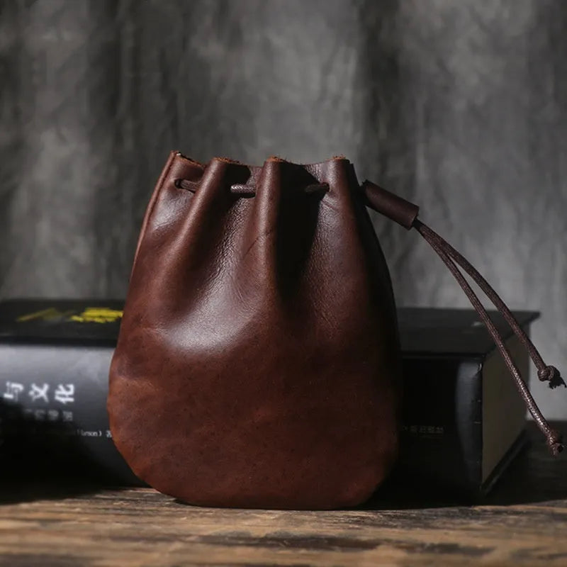 Genuine cowhide leather drawstring bundle wallet in retro style shown in black and chocolate colours.