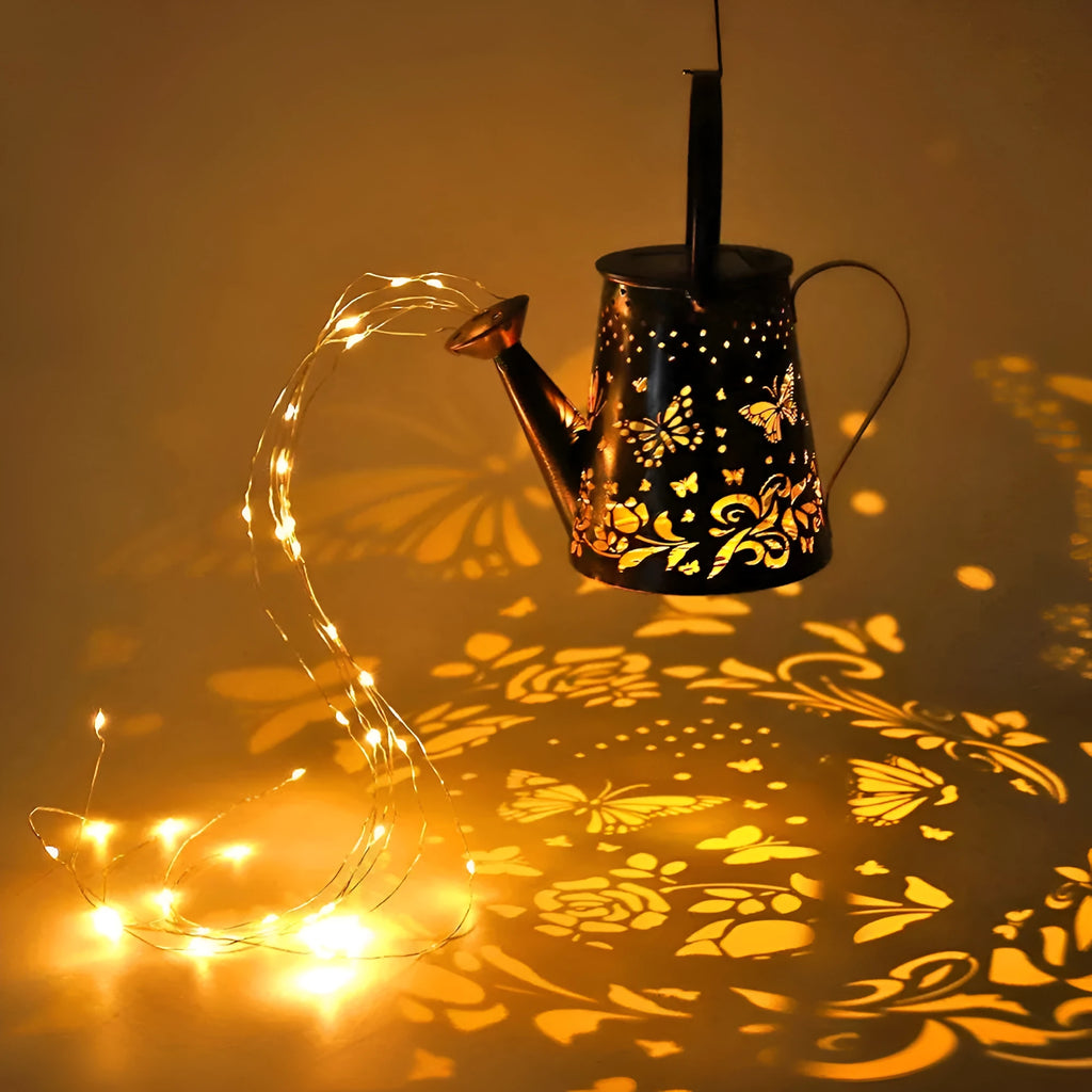 Solar garden lamp with iron tapered butterfly design emitting warm white LED light