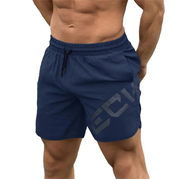 Men's black quick-drying nylon blend training shorts with elastic waist, shown in knee-length sports style.