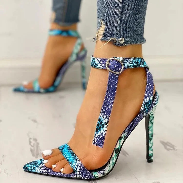 Blue women's high heels with buckle fastening and hollow-out design on artificial PU leather upper.