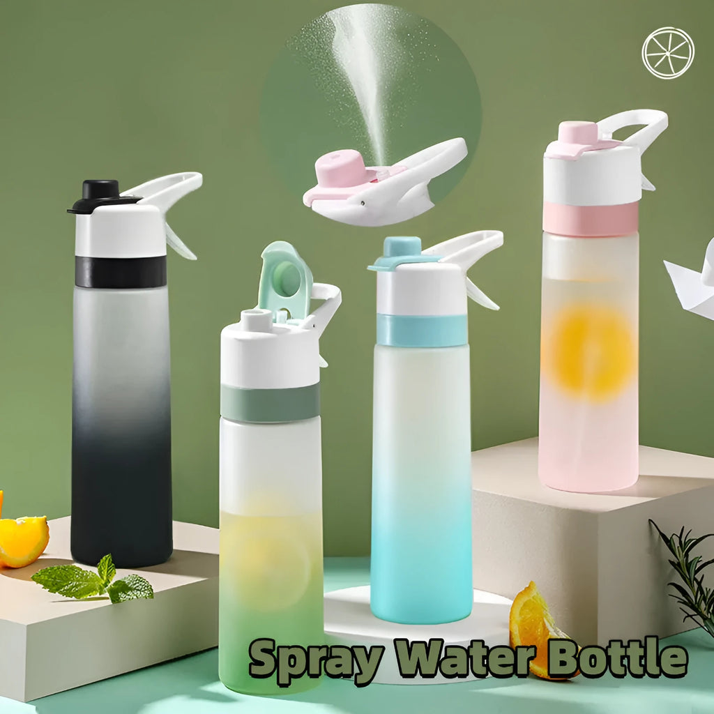 White 700ml plastic spray water bottle with a black handle strap and leakproof lid on a table.