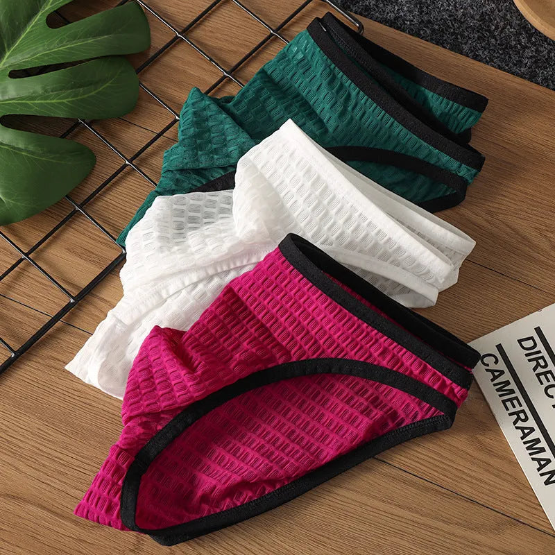 Men's low waist transparent lace underwear shorts in black, green, light purple, rose red, and white colours.
