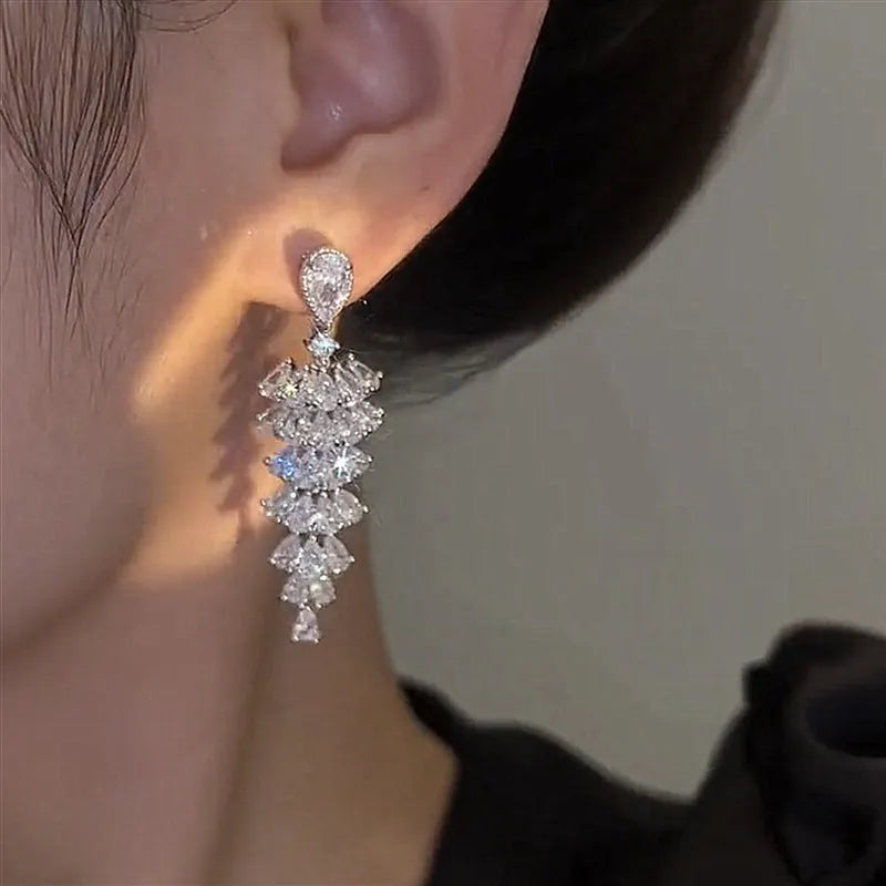 Silver pagoda colour Christmas tree drop earrings with zircon stones on copper stud setting.