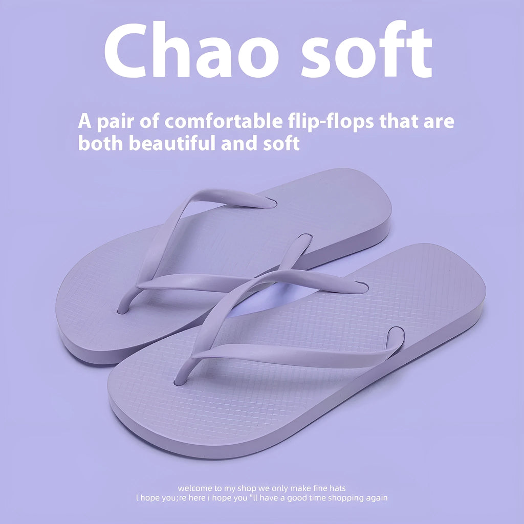 Orange foldable plastic beach slippers with non-slip patterned soles and hollow-out uppers.