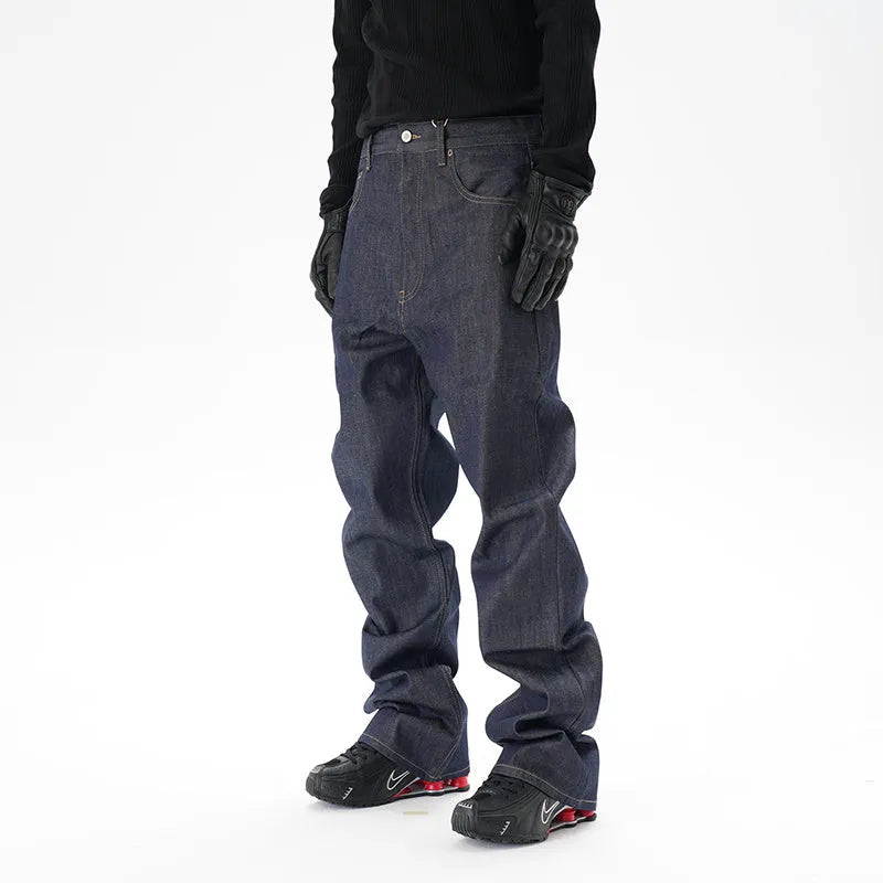 A pair of dark blue loose-fit straight leg jeans on a neutral background.