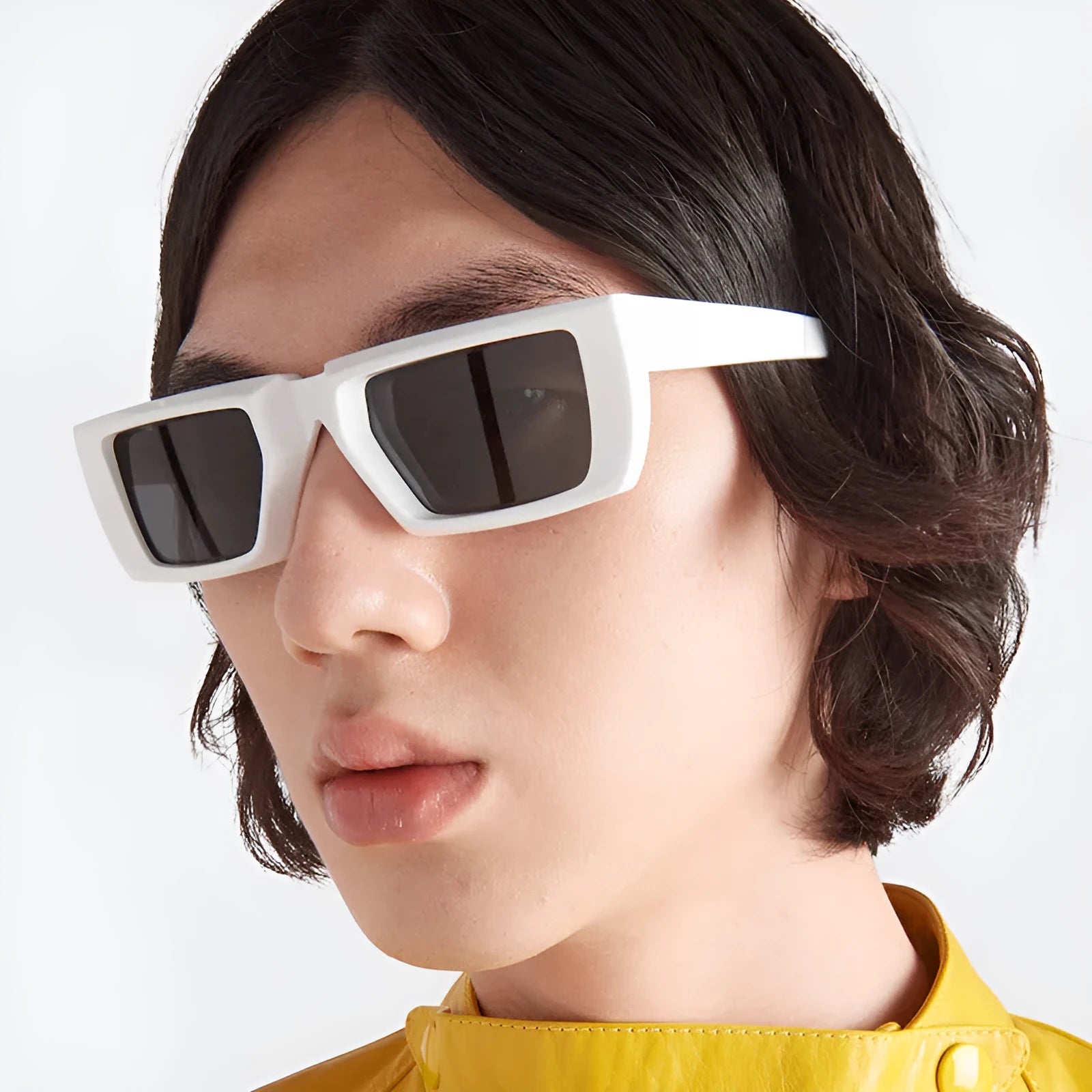 Y2K-style UV400 sunglasses in various frame colours including blue, green, and transparent grey on a plain background
