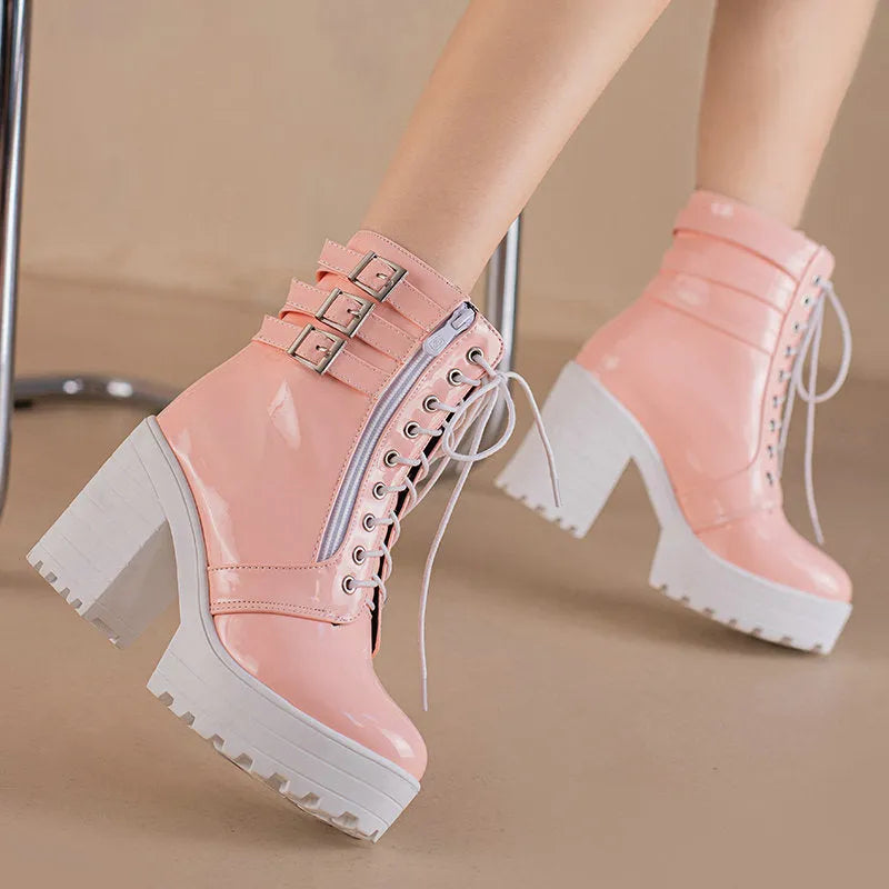 Women's black thick heel ankle boots with round toe and front lace-up on a waterproof platform.