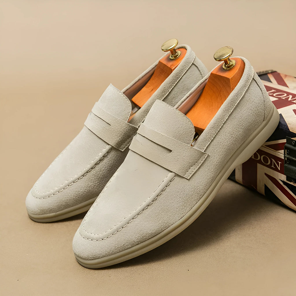 Men's beige leather slip-on casual shoes with a round toe and rubber sole.