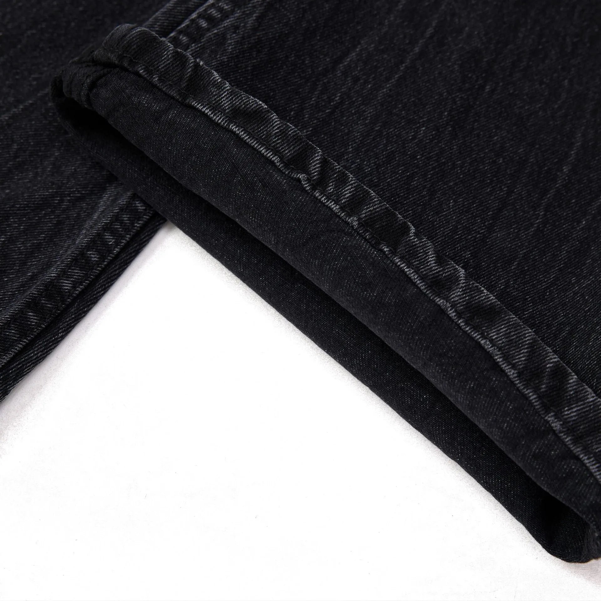 Men's black straight-leg jeans with a lightning crack wash pattern on cotton denim.