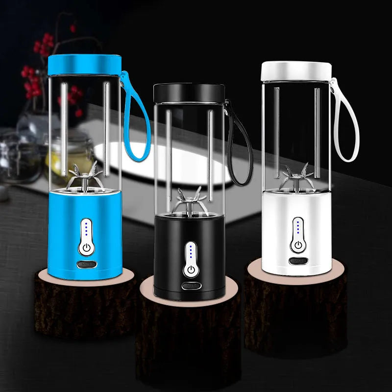 Black portable hand blender with transparent 530ml measuring cup and five-blade cutter head.