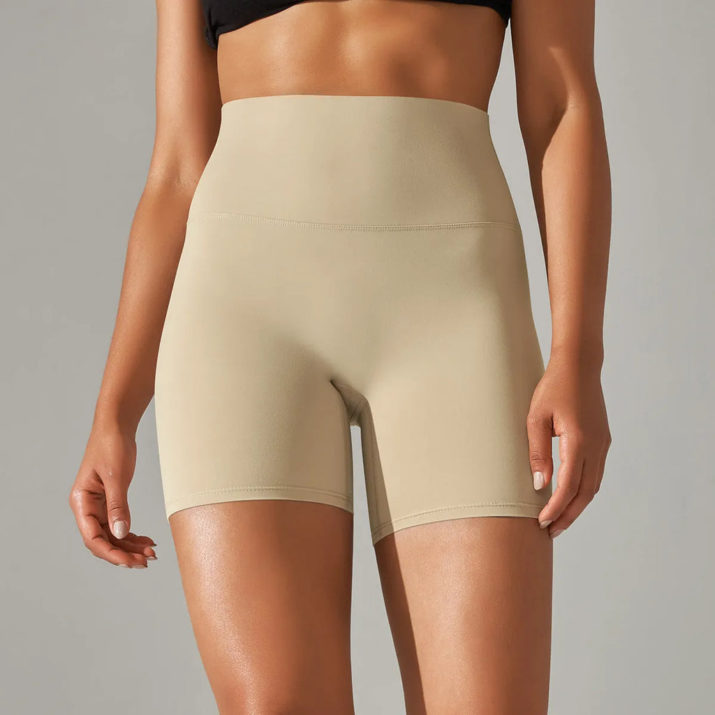 Women's high waist fitness tights in dark green colour with hip lift design for workout and daily wear