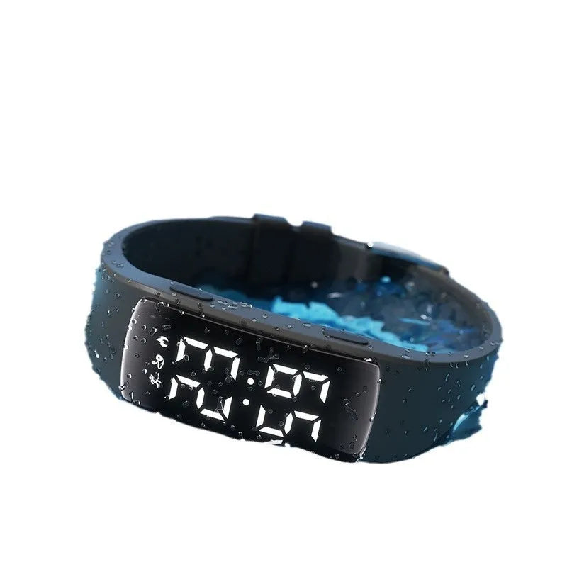 Smart electronic watch with colour options on a silicone strap, showing its LED display and slim profile.