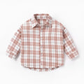 Boy wearing a cotton long sleeve lattice check shirt in khaki, available in sizes from 73cm to 110cm.