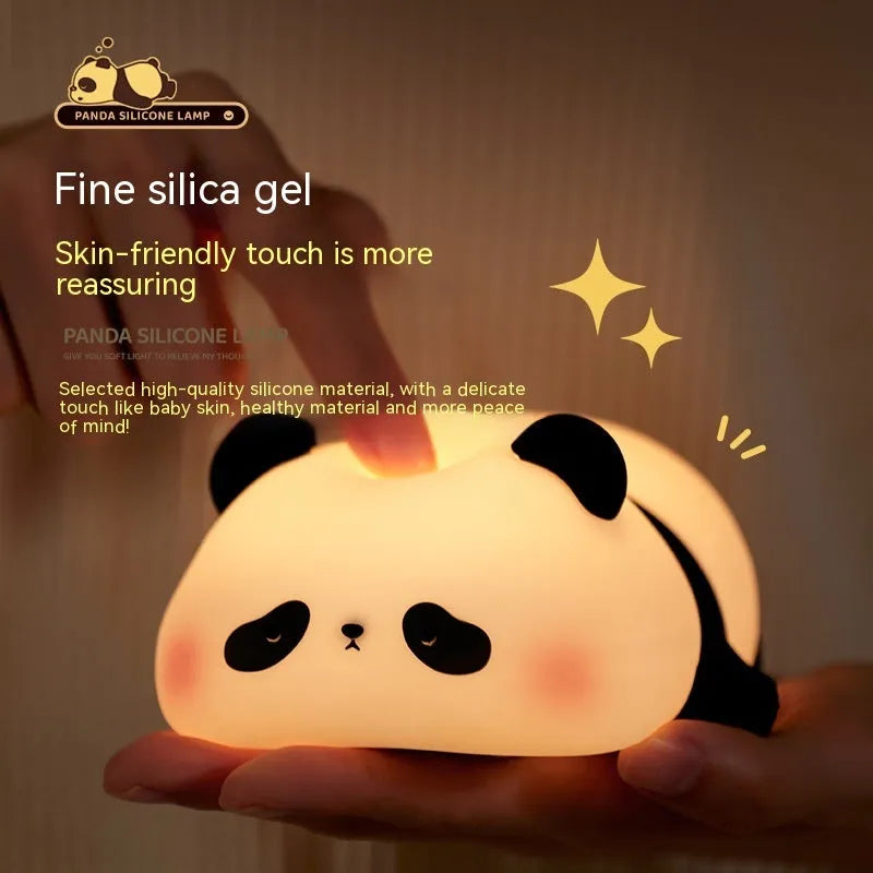 Cartoon panda silicone night light for kids with clap control on a bedside table